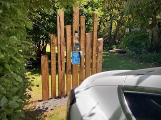 Journey's Rest Destination Charge outlet beside a parked car